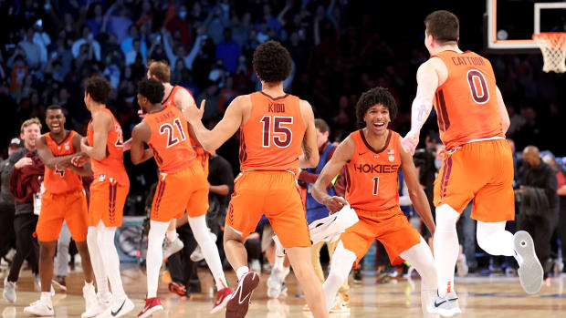 Virginia Tech forward David N’Guessan (1) celebrates with center Lynn Kidd (15) and guard Hunter Cattoor (0) after defeating Duke 82-67 in the ACC Men’s Basketball Tournament final at Barclays Center